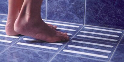 bare feet on a shower floor
