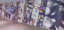 Wall covered with photographs and stories printed on 3M Graphic Films