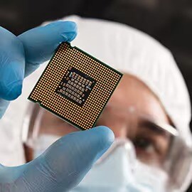 Individual holding a chip.