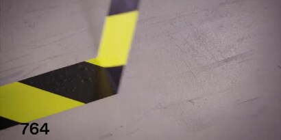 Video still of 3M™ General Purpose Vinyl Tape 764 yellow-and-black stripe tape
