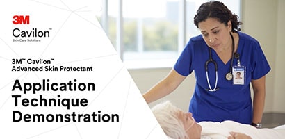 Clinician looking at patient in hospital setting

