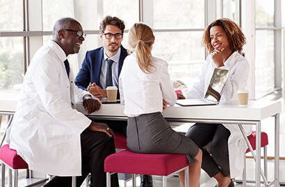 Health care professionals having an informal coffee meeting
