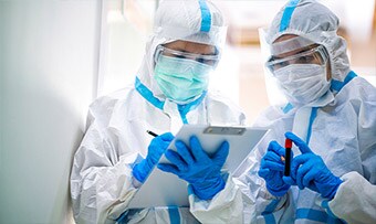 Clinicians using PPE
