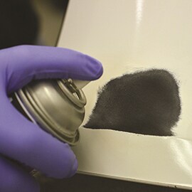 Applying adhesive promoter to auto bumper
