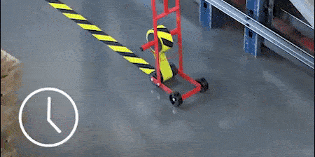 GIF image of a 3M™ Lane Marking Applicator M-1 laying down a black-and-yellow tape
