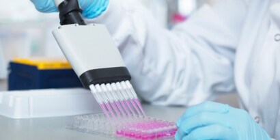 A clinical pharmaceutical scientist  working with an equipment 
