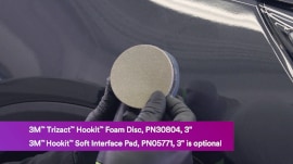 Hookit disc being attached to sander