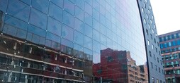 The exterior of a glass building featuring 3M Sun Control Window Films.