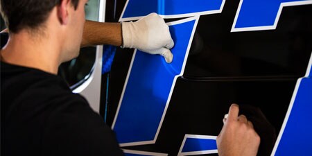 Close up of installer hand across IJ280 film
