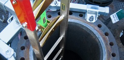 Ladder system installed in vertical confined space access port
