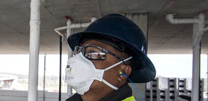 A person wearing a face mask and goggles
