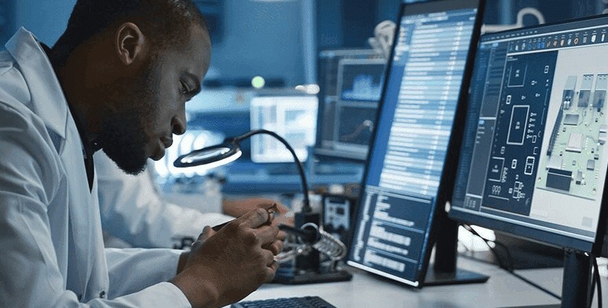 Scientist inspecting industrial interconnect components
