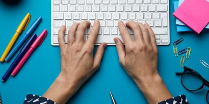 Hands Typing on Keyboard