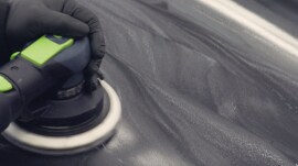 Sander being used on large surface of a car