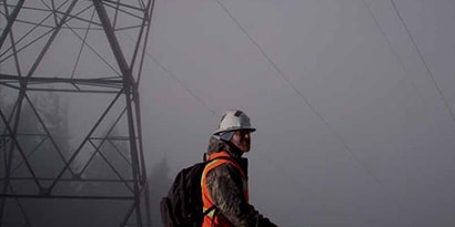 Scotch application image of electrician walking in fog

