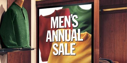 A zoom in view of a promotional sign for an annual sale shirt printed using 3M printable films.
